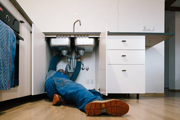 Professional Emergency Plumber technician working in Walker, MI